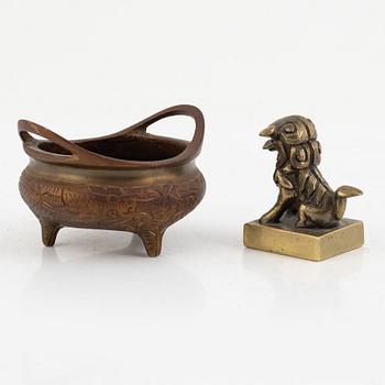 A Chinese bronze seal stamp and a tripod censer, late Qing dynasty, 19th century.