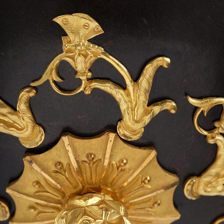 A patinated and ormolu six-light Empire chandelier, Stockholm, first part 19th century.