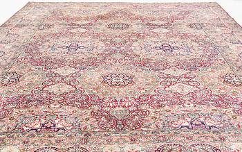 An antique Kerman Laver carpet, south east persia, ca 501 x 359 cm.