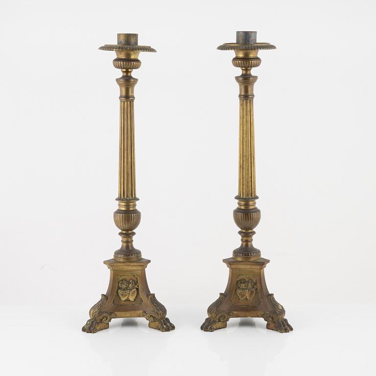 A pair of Baroque style brass altar candleholders, circa 1900.