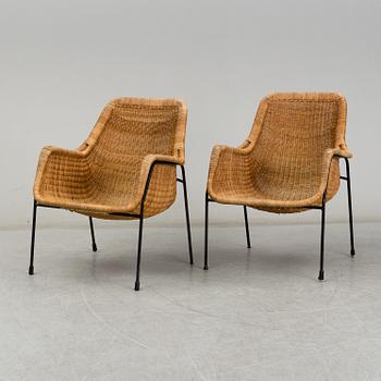 A 1950's pair of rattan easy chairs.