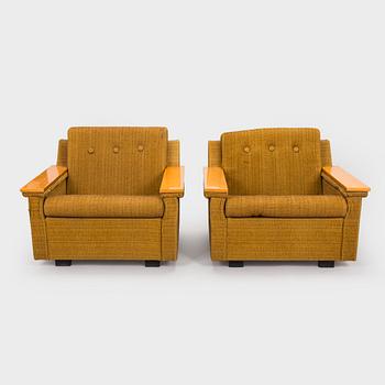 A pair of 1970s armchairs.