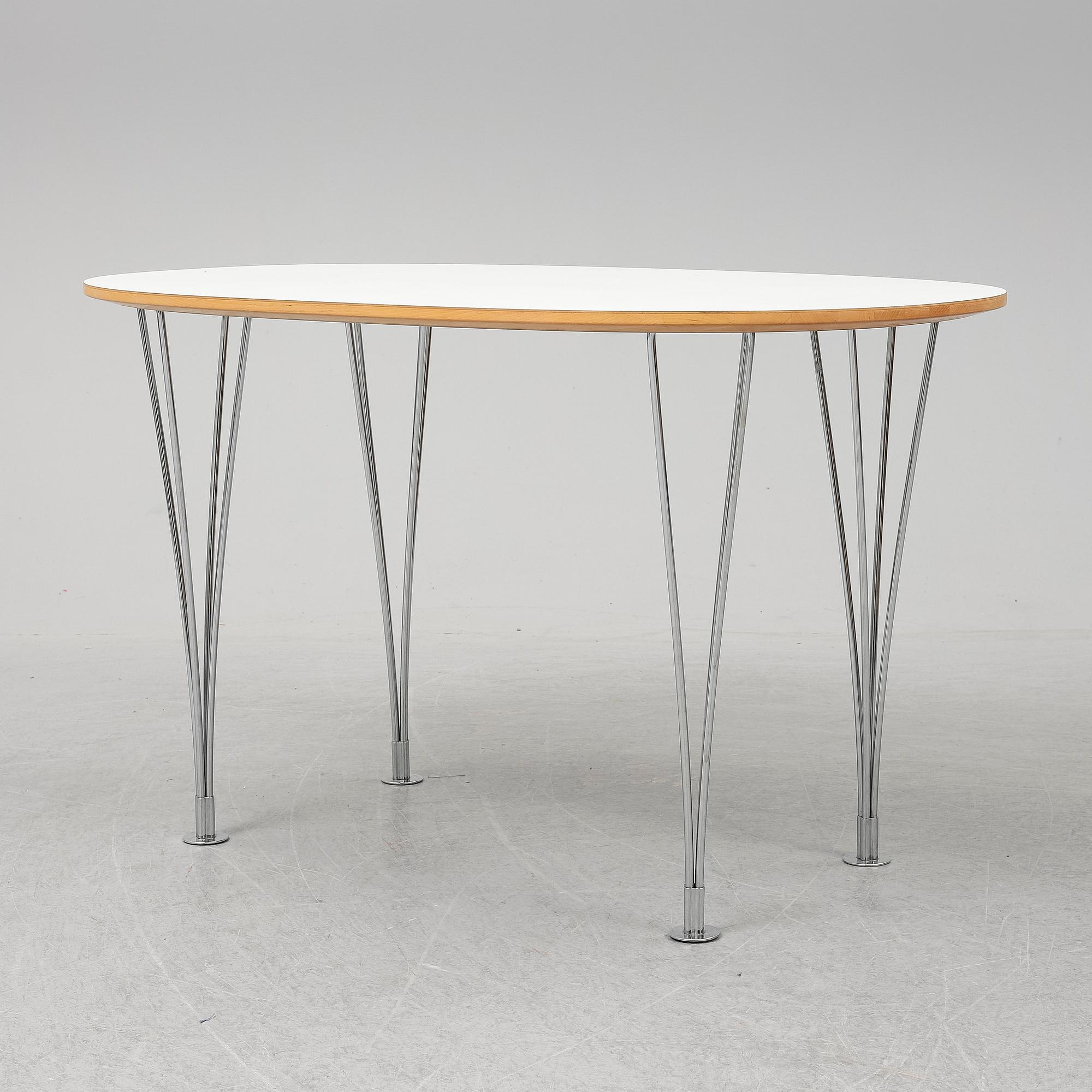 A 'Superellips" table by Bruno Mathsson & Piet Hein for Mathsson International darted 2011.