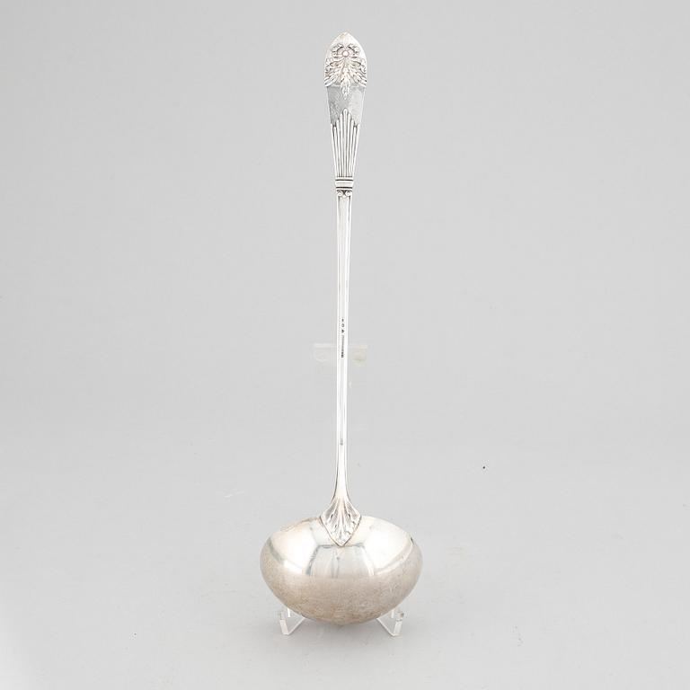 A Swedish silver "Empire" soup ladle, maker's mark Carl Winnerstrand, Stockholm, 1908.