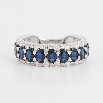 Oval sapphire and brilliant-cut diamond ring.