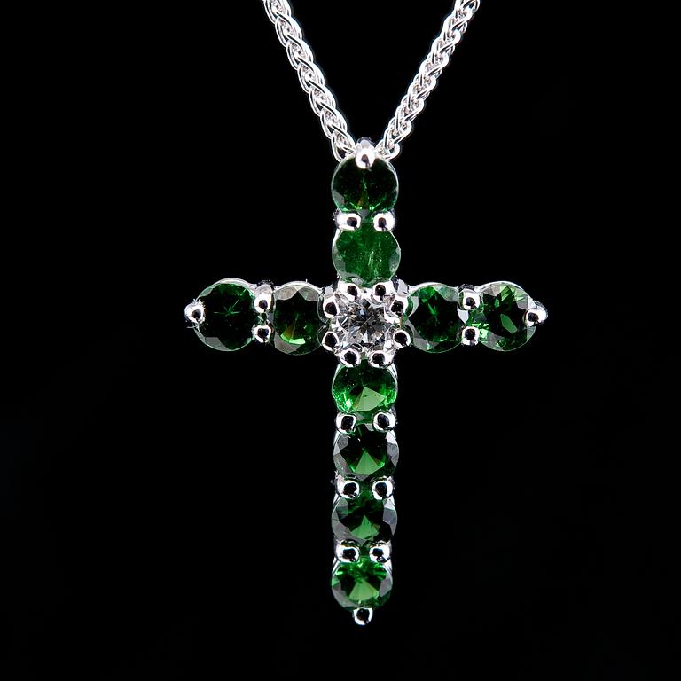 A CROSS PENDANT, 12 tsavorites 0.75 ct, 1 brilliant cut diamond 0,12 ct. VS.