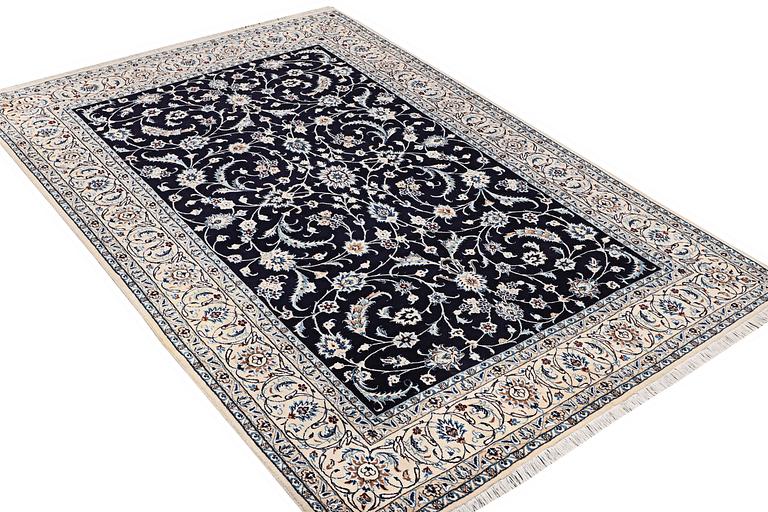 A carpet, Nain, part silk, ca. 295 x 197 cm.