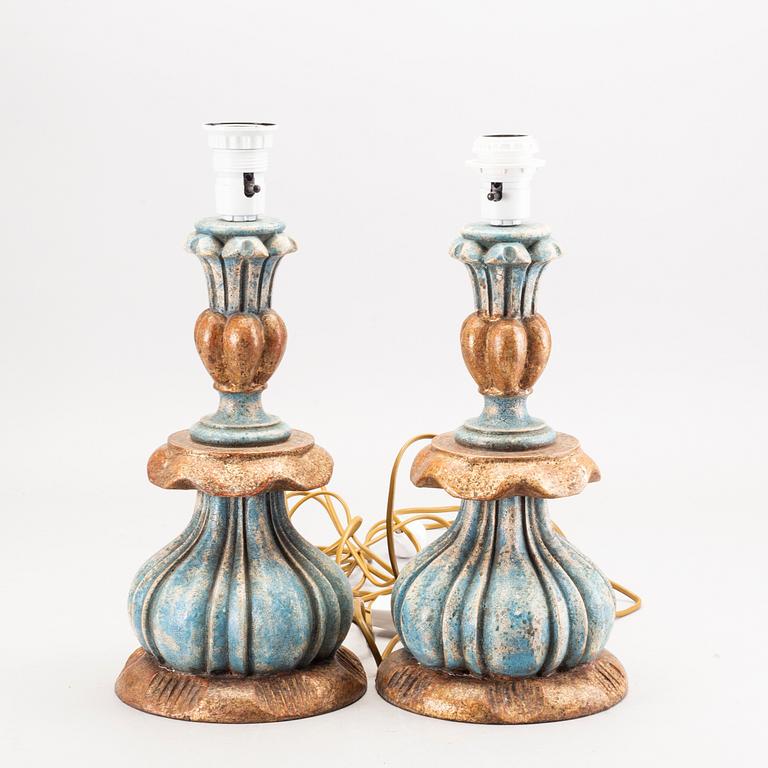 A pair second half of 20th century of wood table lamps from Paoletti, Firenze Italy.