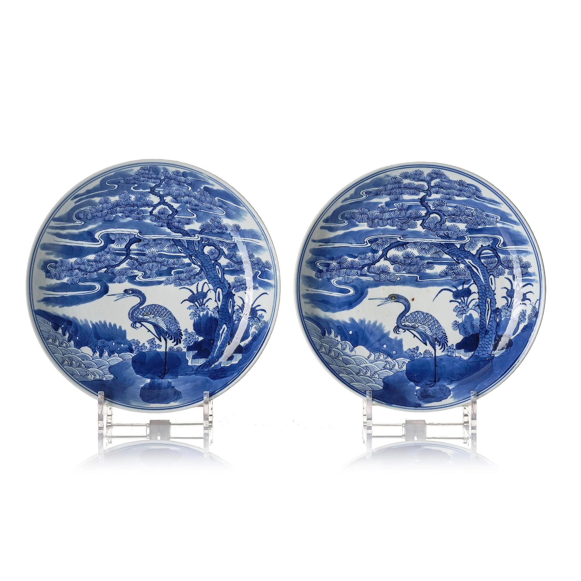 A pair of blue and white 'crane' dishes, Qing dynasty with Guangxu mark and of the period (1875-1908).