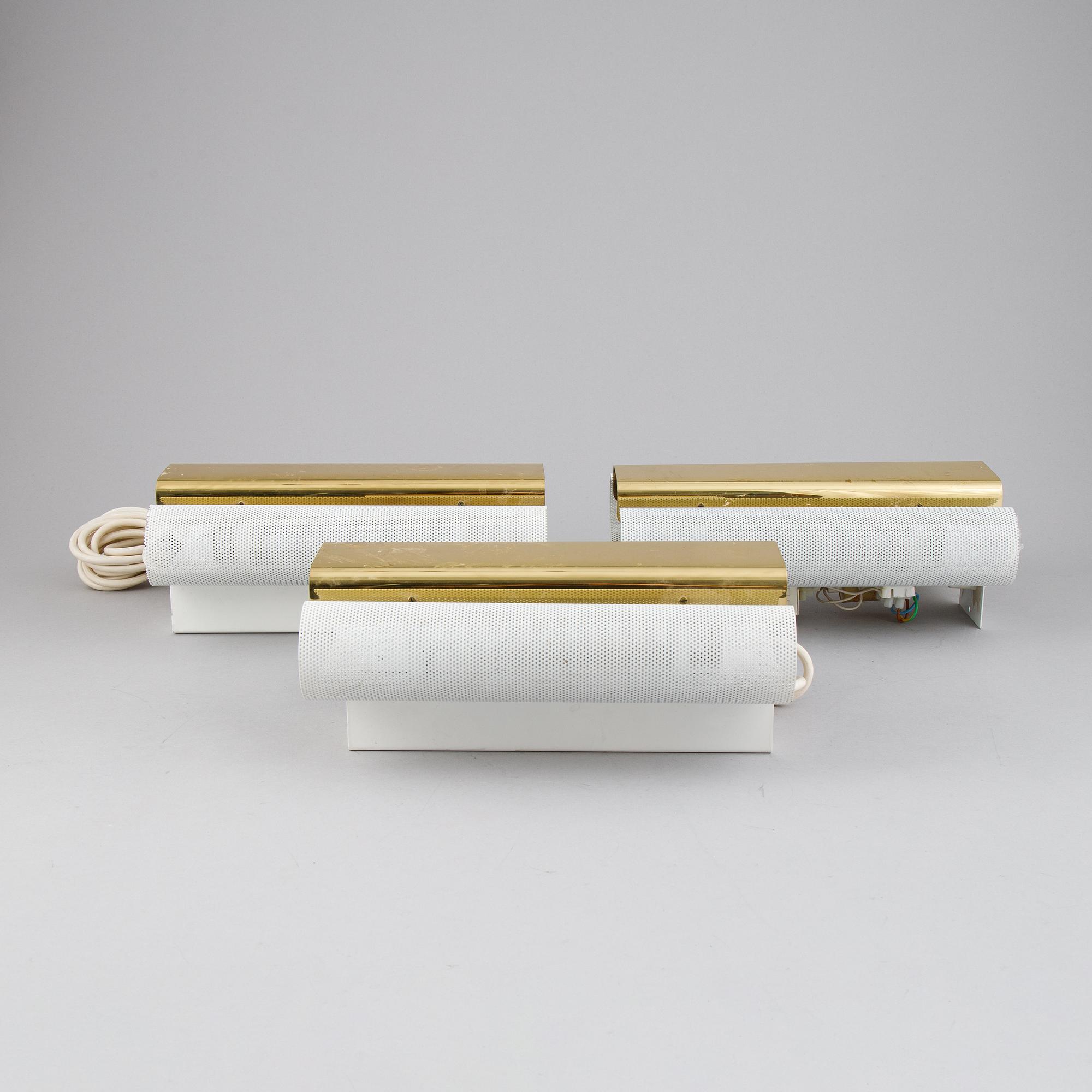 Hans-Agne Jakobsson, a set of three of 'V-451/18L'/'Rasputin' brass wall lights from Markaryd.