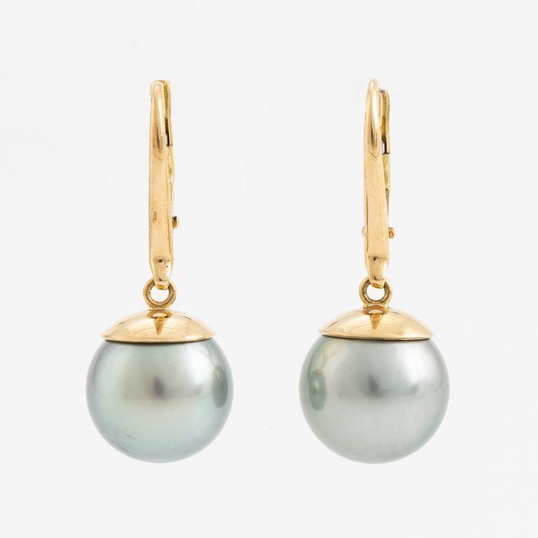 Tahiti pearl earrings.