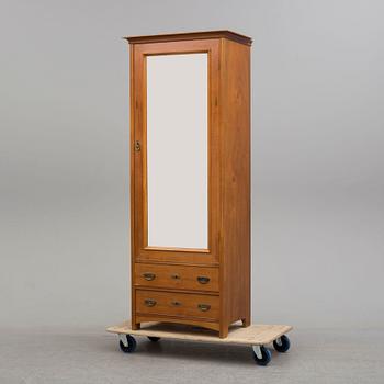 A walnut veneered wardrobe, early 20th Century.