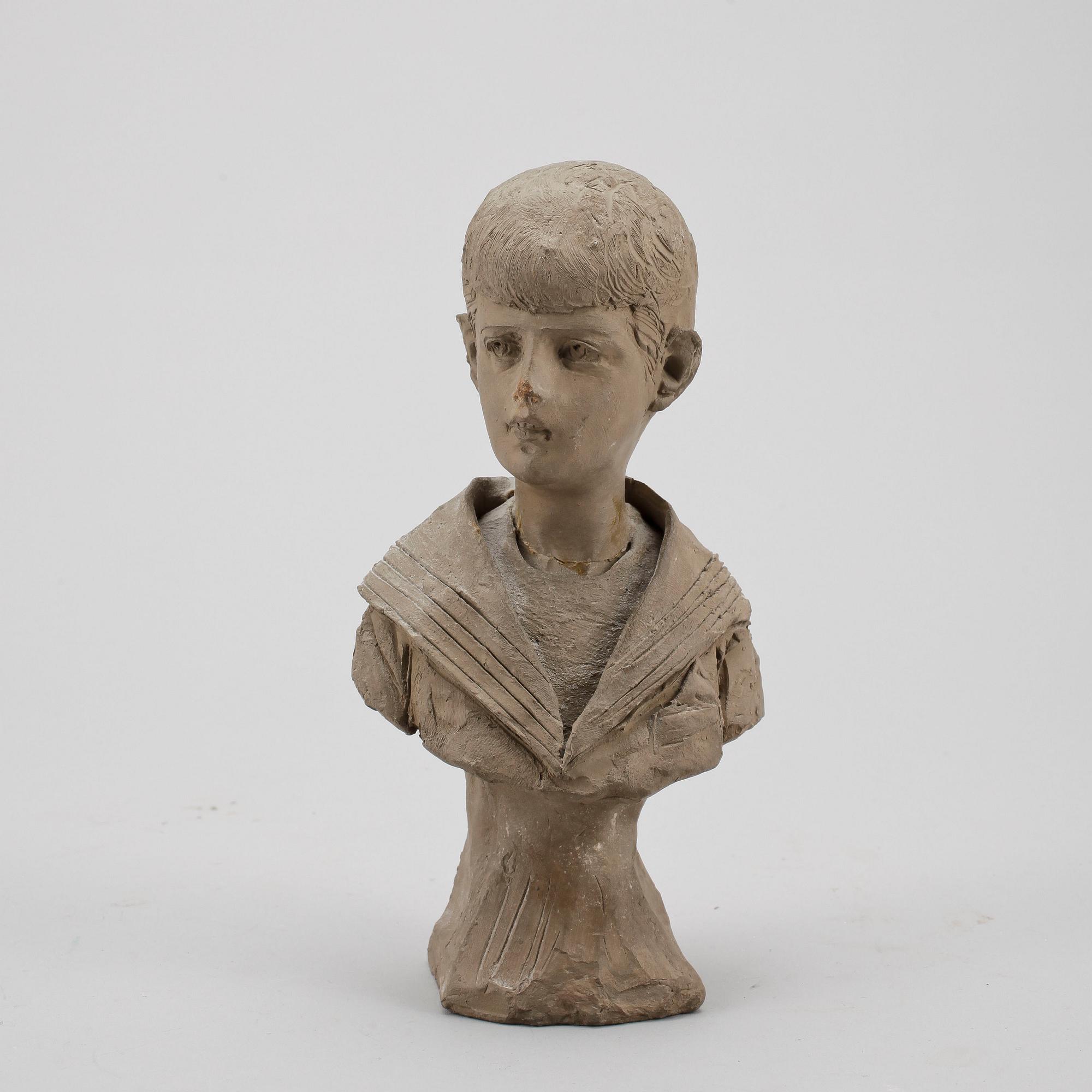 ALESSANDRO MORETTI, porträttbyst, lergods, signerad och daterad 1909.