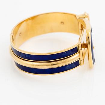 A Gucci bracelet 18K gold with blue enamel.