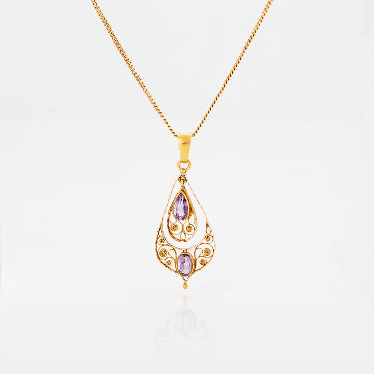 A PENDANT set with amethysts.