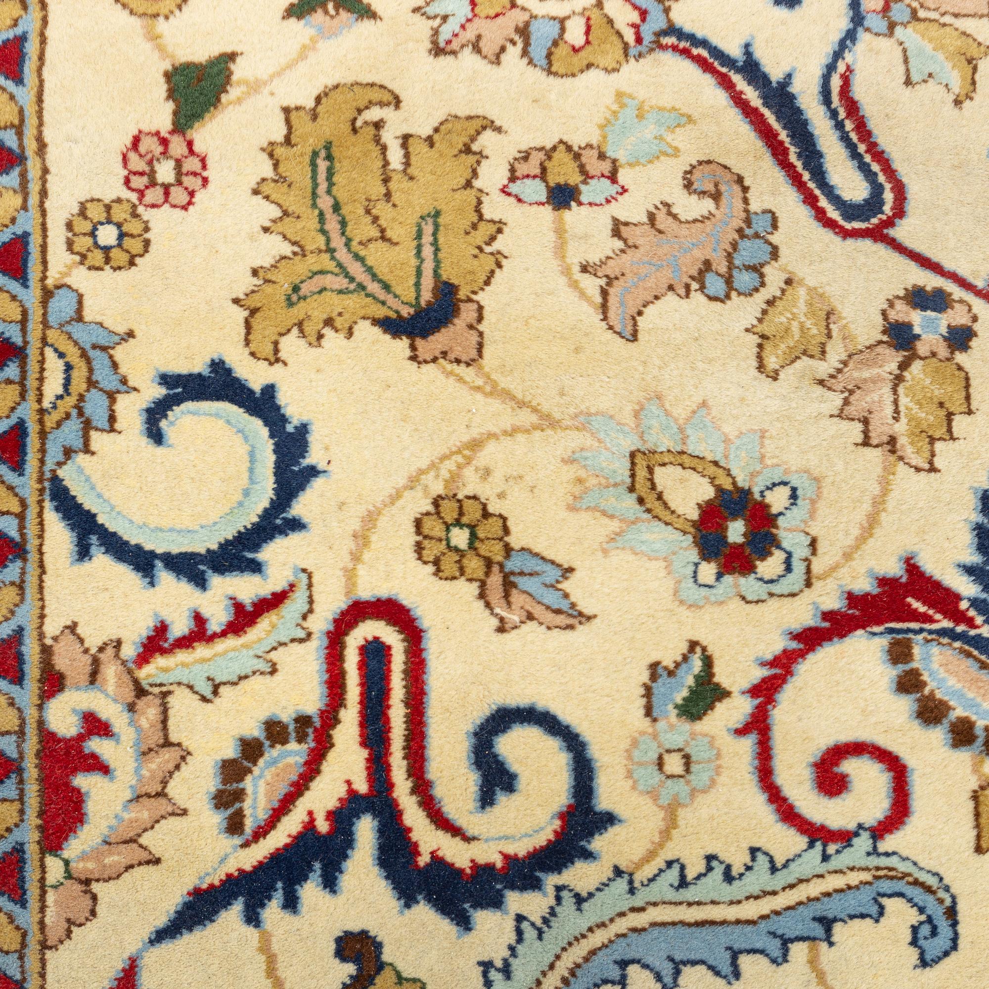 A carpet, signed, circa 286 x 212 cm.