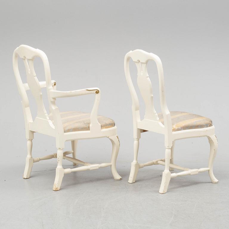 A dining table and six chairs, rococo style, mid 20th century.