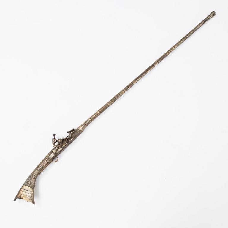 A snaphaunce gun, 19th Century.
