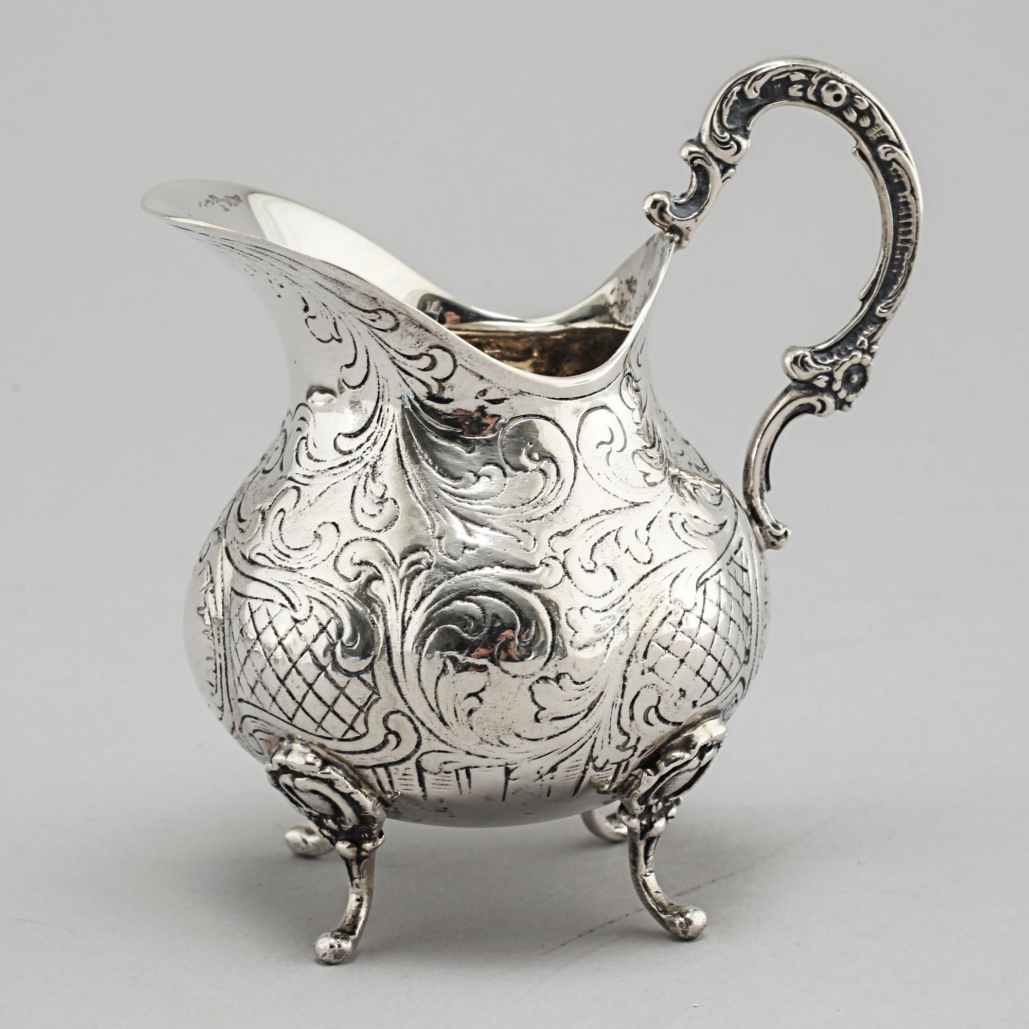 A silver sugarbowl, a cream jug and a tray by J L Hultman, Stockholm, mid 20th century.