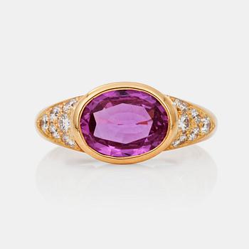 A circa 3.10 ct pink sapphire and brilliant-cut diamond ring. Total carat weight circa 0.50 cts.