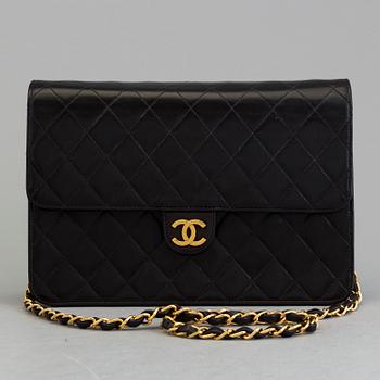 A black lambskin handbag by Chanel 1997-99.