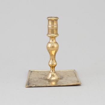 A 17th century bronze candlestick.