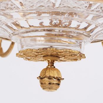 An Empire cut glass and gilded bronze six-light hanging lamp in the manner of Alexandre Guérin.