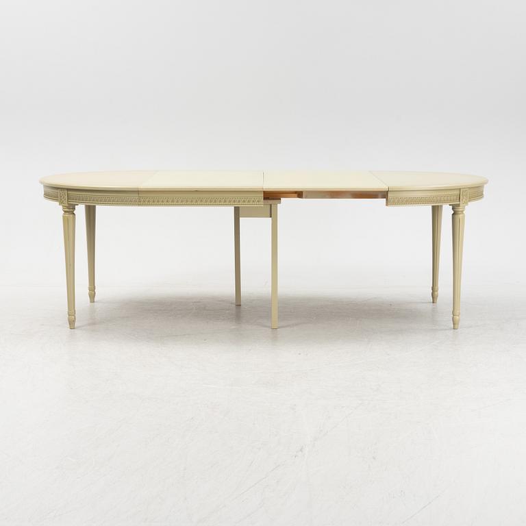 A Gustavian dining table with six chairs. Åmells dated 1974.