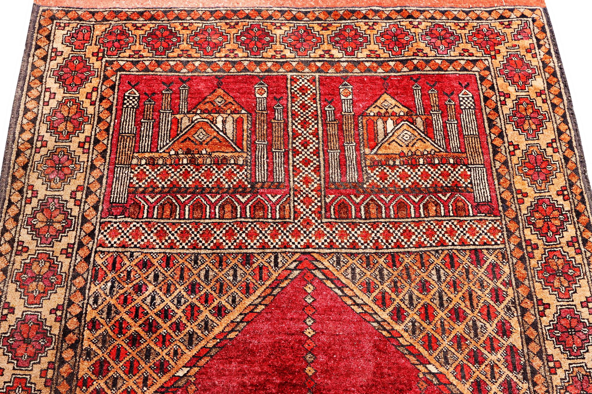A silk Beluch rug, c. 124 x 81 cm.