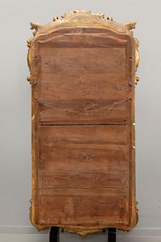 A Swedish Neo Rococo gilded signed mirror 1880s.