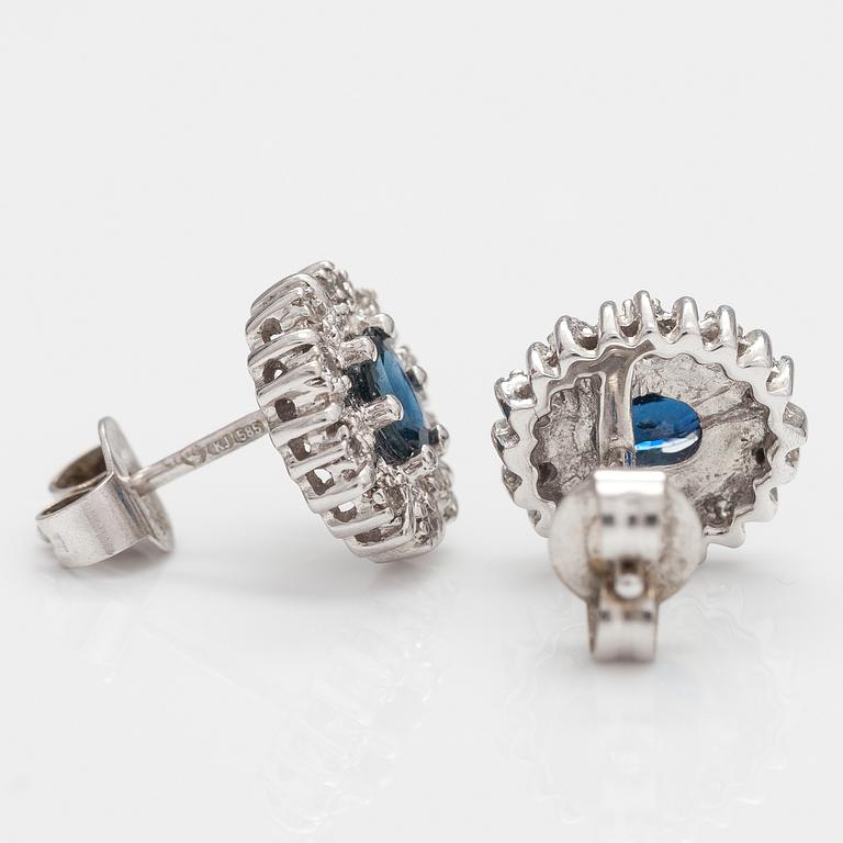 A pair of 14K white gold earrings with sapphires and diamonds ca 0.05 ct in total.