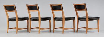 A set of four Josef Frank walnut and black leather chairs, Svenskt Tenn, model 695.