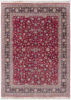 An oriental carpet, a. 378 x 278 cm.