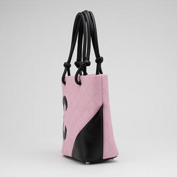 CHANEL, a pink leather "Small Shopping" handbag.