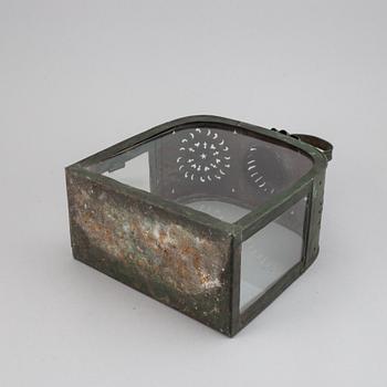 An 18th century tinplate and glass lantern.