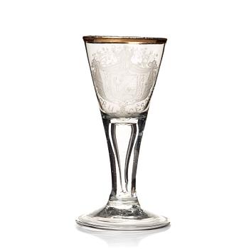 An engraved and gilded armorial wine glass, 18th Century.