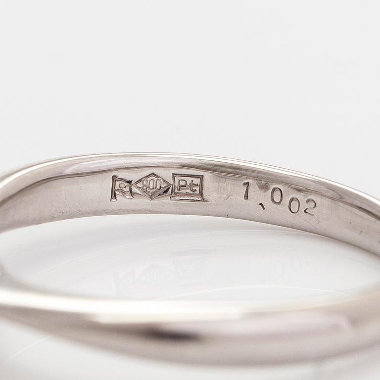 A platinum ring, with a brilliant-cut diamond approximately 1.00 ct according to the engraving.