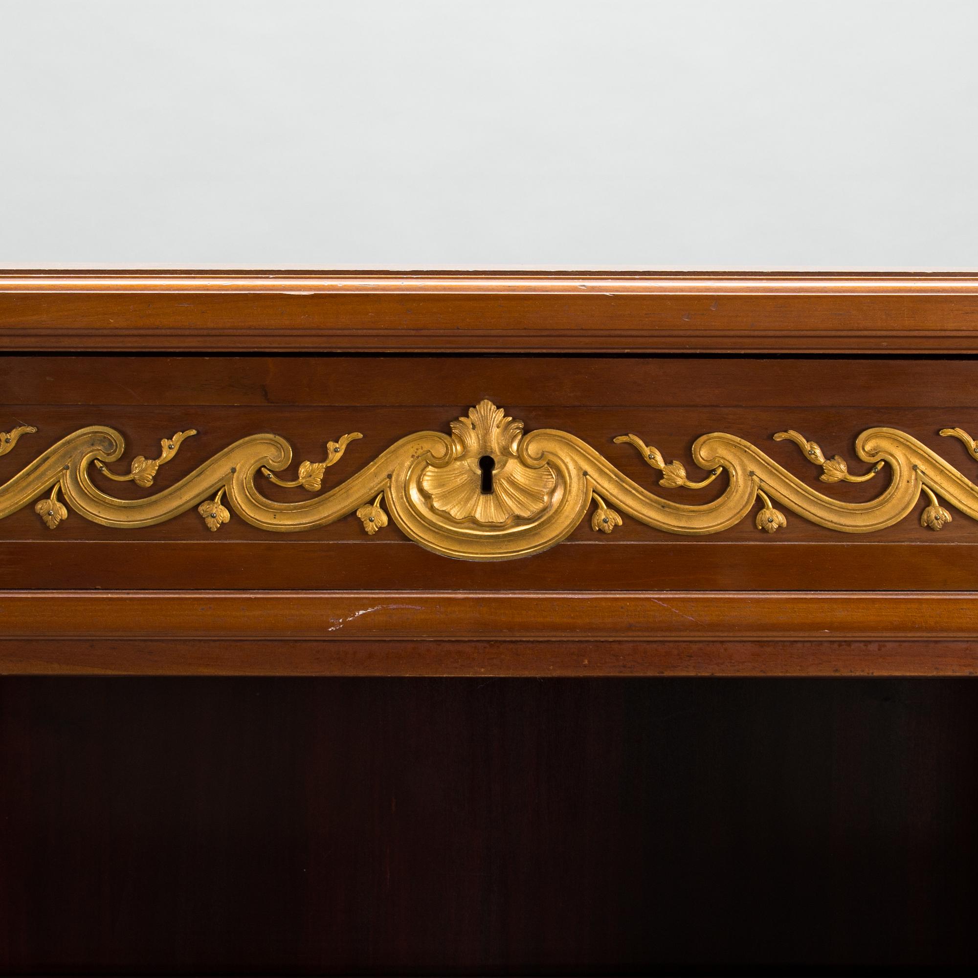 A 20th-century Louis XVI style bookcase.