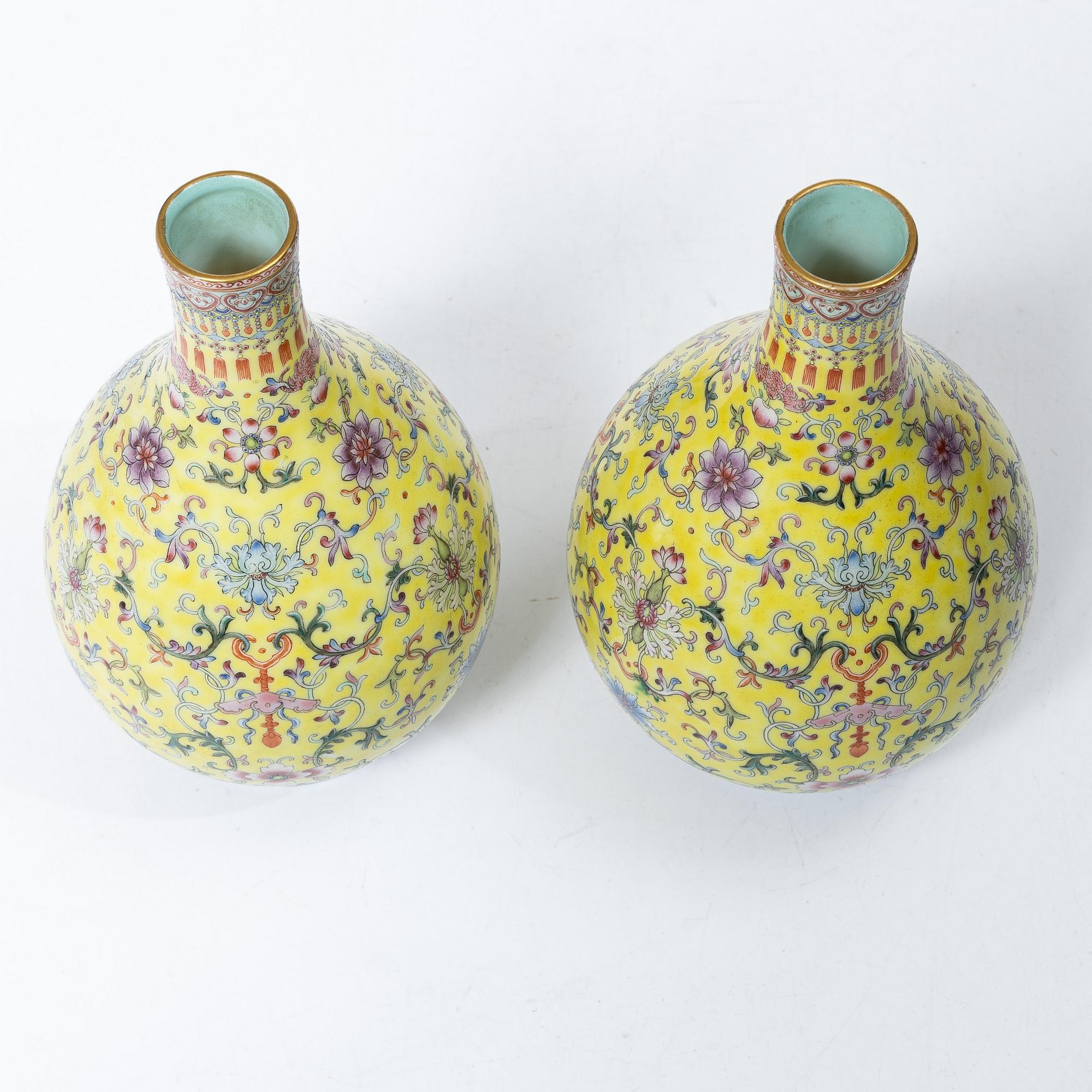 A pair of Chinese yellow ground porcelain vases, 1900s.
