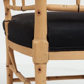 A pair of late Gustavian bamboo imitation armchairs by Ephraim Ståhl, master in Stockholm 1794-1820.
