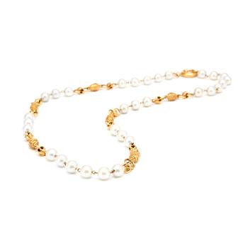 CHANEL, a necklace with decorative white pearls and gold colored embellishment.