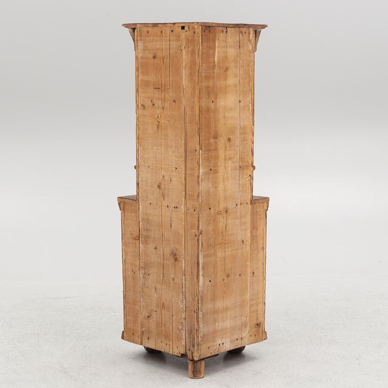 A provincial corner cabinet, early 19th century.