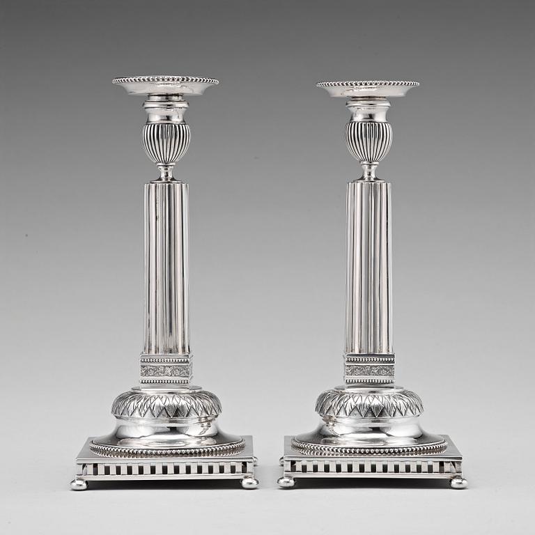 A pair of Swedish 18th century silver candlesticks, Stephan Westerstråhle, Stockholm 1793, one nozzle J E Torsk 1895.