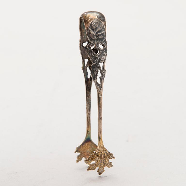 Four silver objects from the 20th Century.