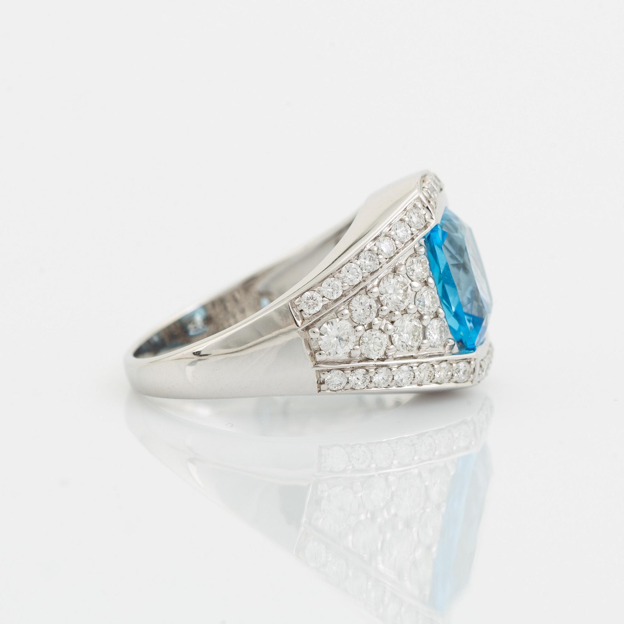 Blue topaz and brilliant cut diamond ring.