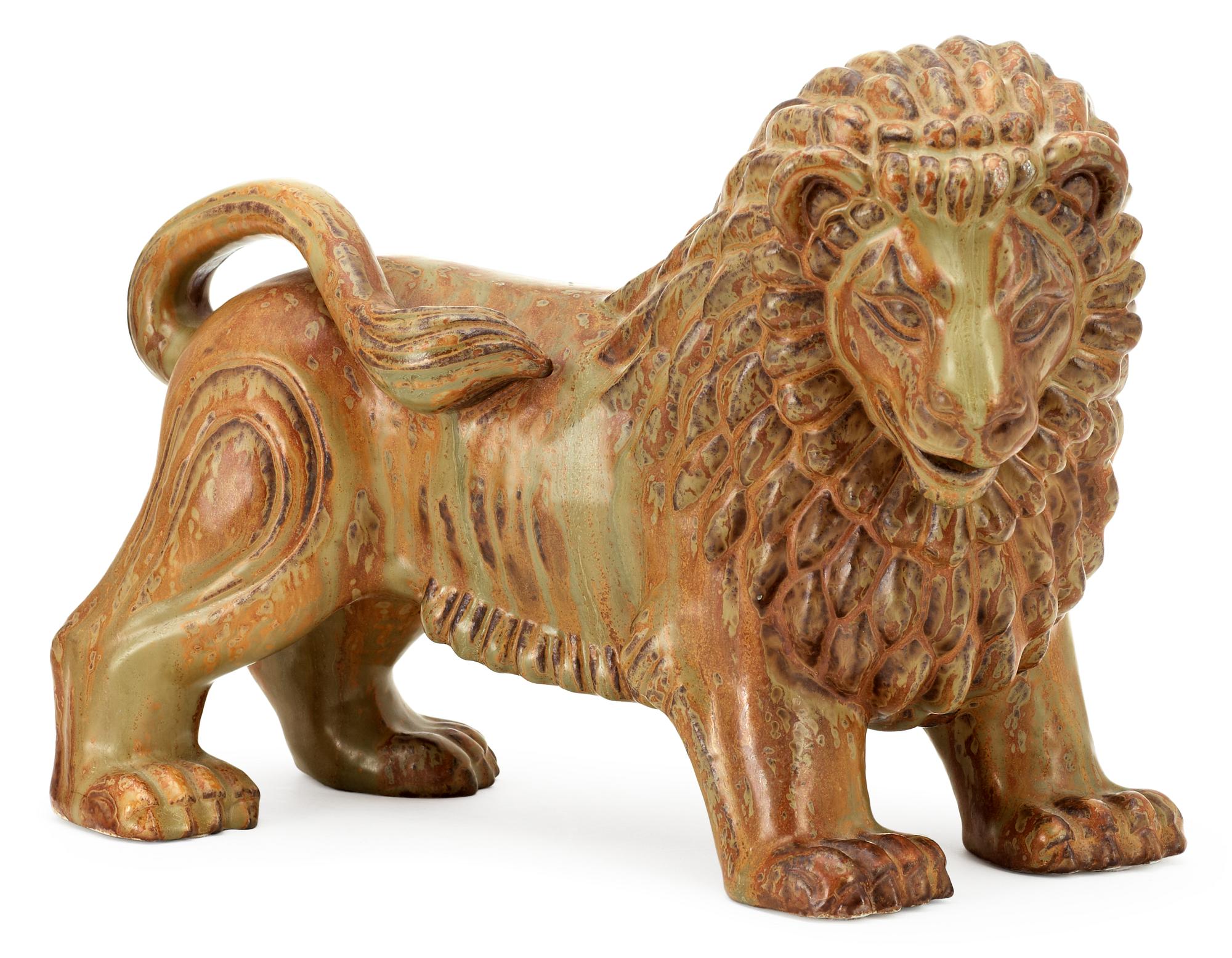 A Gunnar Nylund stoneware figure of a lion, Rörstrand.