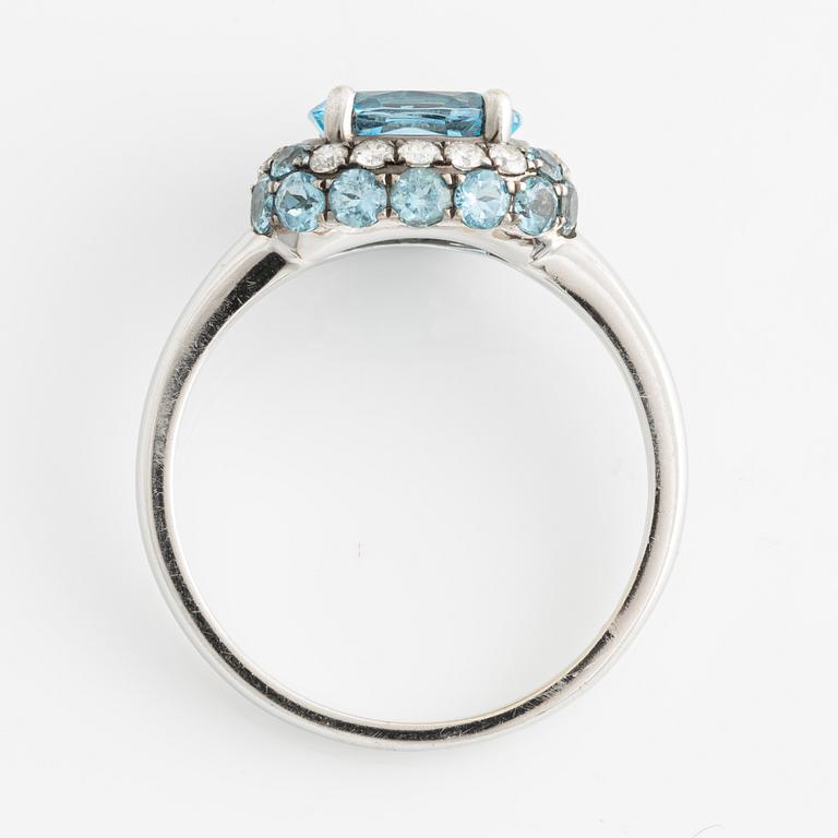 Ring, white gold with topazes and small brilliant-cut diamonds.