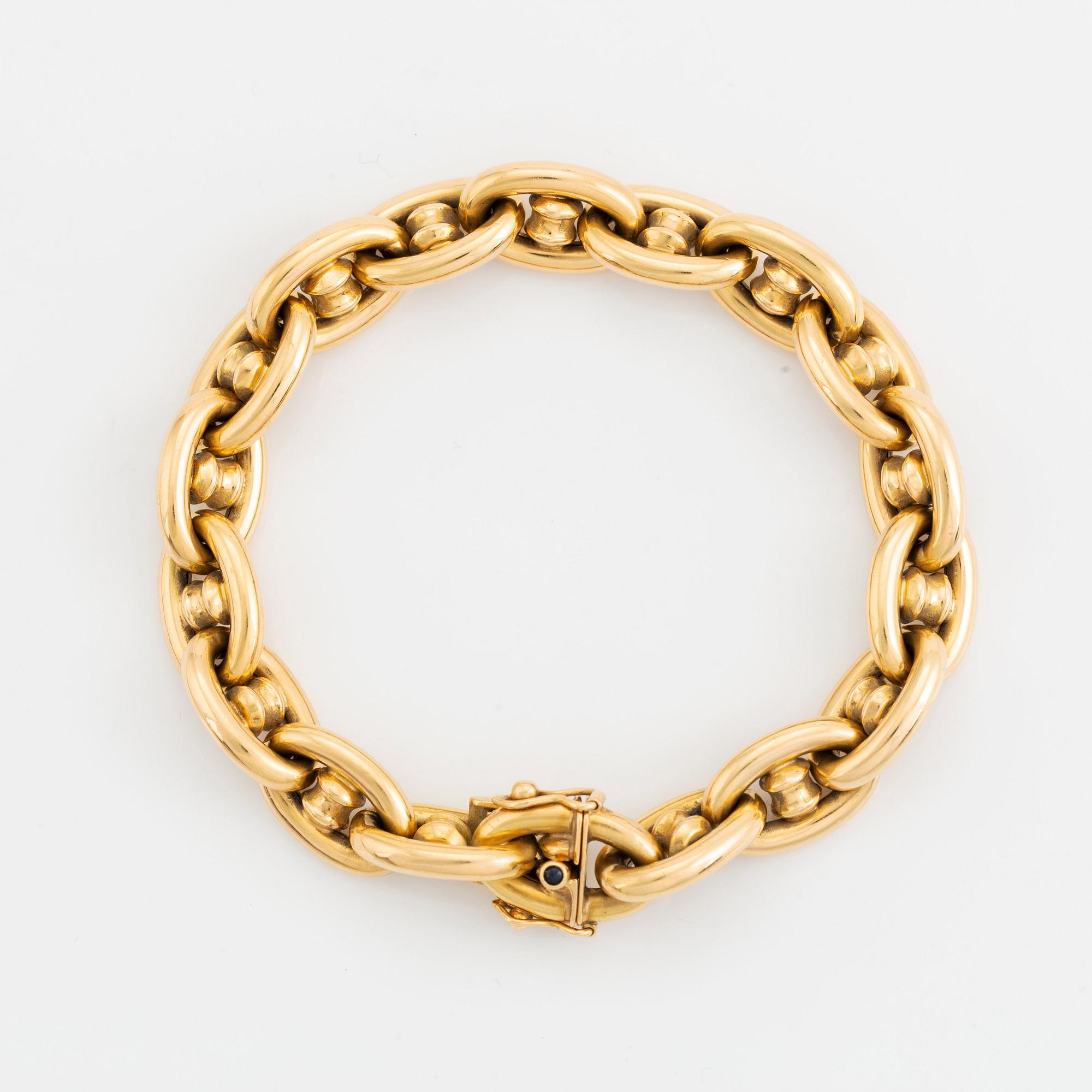 An 18K gold bracelet.