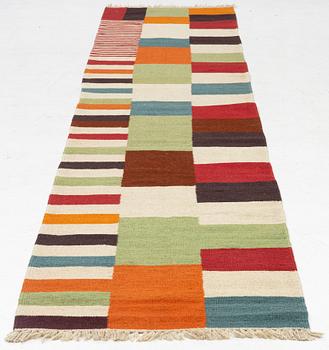 A Kilim runner, c. 388 x 80 cm.