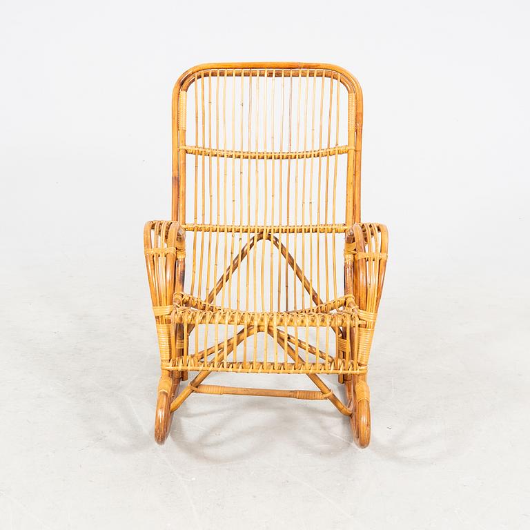 A bamboo and rattan mid 1900s rocking chair.